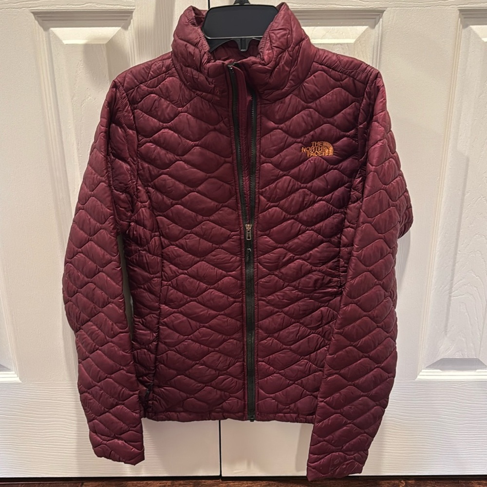 The North Face Women's Burgundy Quilted Puffer Jacket with Gold Logo